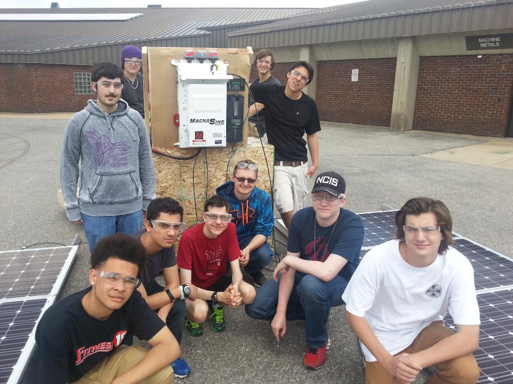 Students assisted in assembling and testing a residential solar PV system.