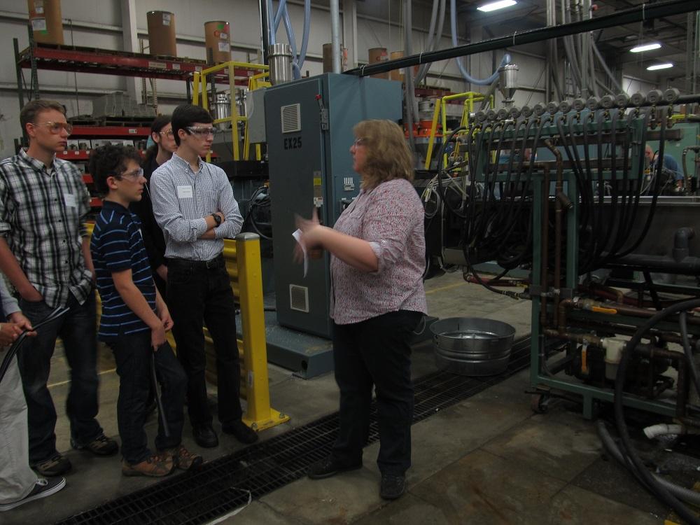 Students observe extrusion process