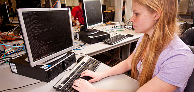 student programming a customer computer