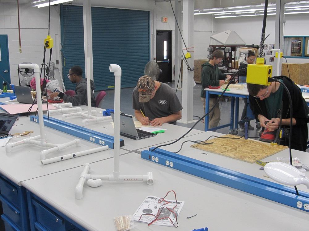 Students construct small-scale wind turbines.